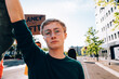 © Carlo Prearo - Young man holding a protest sign at a climate change march