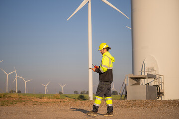 Aufkleber - Engineer man working at windmill farm Generating electricity clean energy. Wind turbine farm generator by alternative green energy.