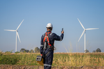 Aufkleber - Engineer man working at windmill farm Generating electricity clean energy. Wind turbine farm generator by alternative green energy.