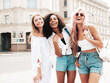 © halayalex - Three young beautiful smiling hipster female in trendy summer clothes.Sexy carefree multiracial women posing on the street background.Positive models having fun