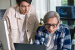 © weedezign - Group of asian senior in a collaborative software development analyzing  flowcharts  during a bootcamp training