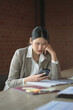 © mojo_cp - Asian woman reading some bad news on smartphone, worry and stressed