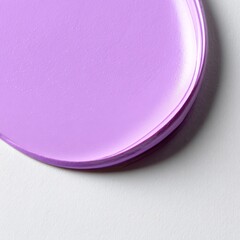 Poster - Minimalist close-up of a glossy light purple circular object with visible texture, casting a subtle shadow on a white textured background.