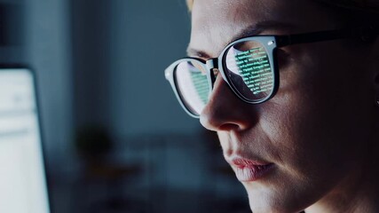 Aufkleber - Close up view revealing concentrated programmer wearing glasses, reflecting illuminated code while working intently during late night software development session