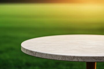 Fototapete - Empty marble table displaying on blurred green soccer field background