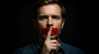 © Helen - a man with red tape over mouth makes silent gesture with finger. Censorship and freedom of speech suppression concept.