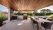 © Beste stock - a sleek outdoor kitchen with a built in bbq grill minimalist countertops and a shaded dining area with designer furniture