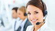 © JT Studio - A smiling woman with a headset in a bright office setting, representing customer service and communication.