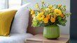 © Friendly Studio - Green vase holding bright yellow florals on a modern wood nightstand with soft morning light