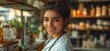 © Kzr808 - Smiling female health professional in store, shelves blurred. Use healthcare, well-being