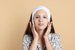 © New Africa - Teenage girl with sheet facial mask on beige background. Acne treatment