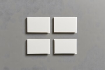 four blank white business cards mockup on gray background