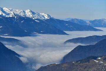 Fototapete - Winter scenery of French alps with tones of blue under clouds and snow
