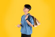 © Evolusix - a man with brown shopping bag in his shoulder and holding a phone  while looking up