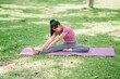 © PSG - Beautiful Asian woman practicing yoga pose Utthita Trikonasana