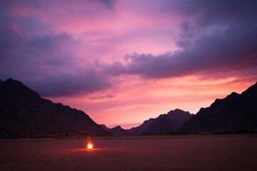 Aufkleber - A solitary figure stands before a bright bonfire in the desolate desert, as sunset colors fill the sky and shadows dance across the rough landscape