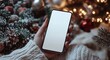 © Julia - A close-up shot captures a person holding a mobile phone, its screen empty and ready for content, demonstrating the significance of digital connection in today's world