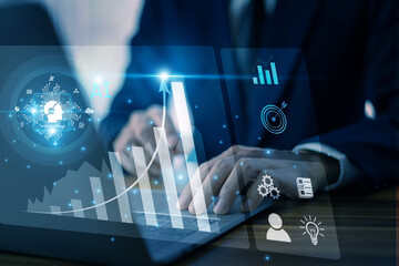 Wall Mural - businessman using ai technology to analyze data with futuristic hologram interface on laptop for bus