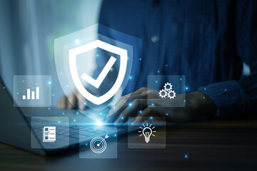 Wall Mural - employee using ai-powered security system on laptop for digital asset protection and advanced cyber 