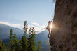 © zhukovvvlad - climber boy. the child trains in rock climbing. cute teen kid climbing on rock with insurance, lifestyle sport people concept.