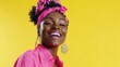 © Johannes - Happy optimistic African American woman in colorful pink clothes laughing isolated on yellow background