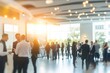 © somsuda - Blurred business professionals networking and socializing at modern event with natural light