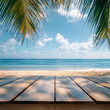 © Oleksandr Sylenko - Empty background with wooden floor on beach with palm trees. banner for advertising product. Wooden tabletop in front. blurred background. empty bar counter