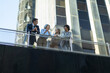© luisrojasstock - Business people talking on balcony of modern office building