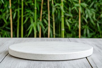 Poster - Empty round stone tabletop on wooden plank with blurred bamboo forest background