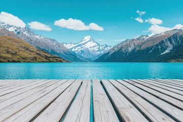 Aufkleber - Wooden deck overlooking vibrant alpine lake and majestic snow-capped mountains