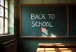 © Aimstock - Back to school words written by white chalk and red chalk for heart shape on blackboard in vintage classroom with table and sun light through the window. concept for education and nostalgia