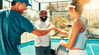 © peopleimages.com - Happy, people and tennis with fist bump for teamwork, success or friendly match on outdoor court. Group, friends or sports players with smile, padel or huddle for mission, game challenge or meeting