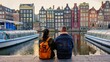 © Fokke Baarssen - Two people enjoy a serene moment by the canal in Amsterdam, surrounded by charming colorful buildings and gentle boats. couple of man and woman on a city trip during autumn or winter