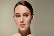 © LIGHTFIELD STUDIOS - Beautiful young woman with radiant skin showcasing natural beauty in a serene setting