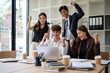 © wattana - Excited business team celebrating success at work. Corporate motivation and teamwork concept.