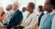 © Jessy/peopleimages.com - Conference, audience and people listening to business seminar with employees or team in crowd. Female person, feedback and group in meeting, presentation or training for corporate career at company