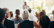 © Jessy/peopleimages.com - Presentation, question and speaker with business people in office for conference, training and meeting. Corporate, answer and workers with hands raised in discussion, convention and finance seminar