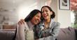© peopleimages.com - Hug, laugh and relax with friends on sofa for reunion, bonding and happiness. Funny conversation, love and support with women and embrace in living room at home for trust, communication and care