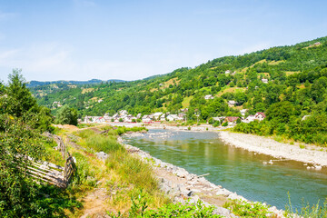 Wall Mural - tisza river running through the valley. beautiful view. sunny weather in summer. mountainous country