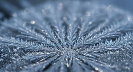 A close up view of a delicate snowflake pattern with intricate details in a cool blue tone and bokeh lights