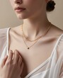 © Sina Blaze - An elegant shot of a woman’s neckline adorned with a minimal gold necklace, highlighting refined style and sophistication, ideal for jewelry or fashion advertising.