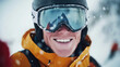 © Keopaserth - close up shot of skier smiling confidently, wearing helmet and goggles, surrounded by snowflakes in winter landscape. joyful expression captures thrill of skiing