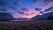© Maksum Udod - Stunning twilight landscape with mountains and shimmering stars above a peaceful lake at dusk in a serene countryside setting.