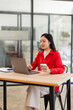 © David - Business Employee Asian woman working on laptop document archives on folders papers at busy work at desk workplace office. Business Documents concept.
