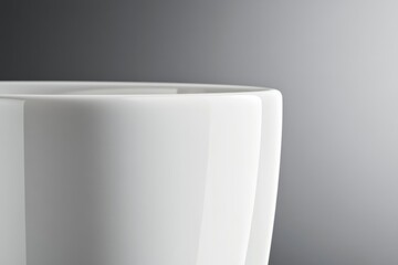 Poster - Close-up view of a porcelain bowl highlighting its smooth, glossy surface and elegant design in soft light, ideal for adding sophistication to any kitchen setting