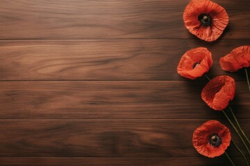 Leinwandbilder - Poppy flowers are artistically arranged on a rustic wooden surface with soft natural lighting, showcasing their vibrant color and gentle texture