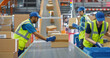 © Gorodenkoff - Workers in High-Visibility Vests Redirect Packages Along a System of Conveyor Belts in a Distribution Hub. Male and Female Working in Large-Scale Retail E-Commerce Operation or Logistics Service