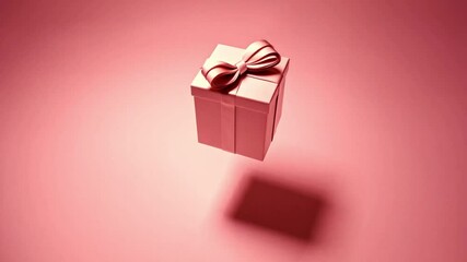 Poster - A beautifully wrapped pink gift box with a large bow is captivatingly suspended against a soft holiday-themed background. This charming visual evokes a sense of celebration and joy.