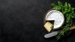 © tugkiara - Fresh Camembert and Cheese Selection on Dark Surface
