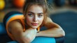 © sitifatimah - Young woman lying down smiles, resting after workout, focusing on her wellness, strength, beauty.